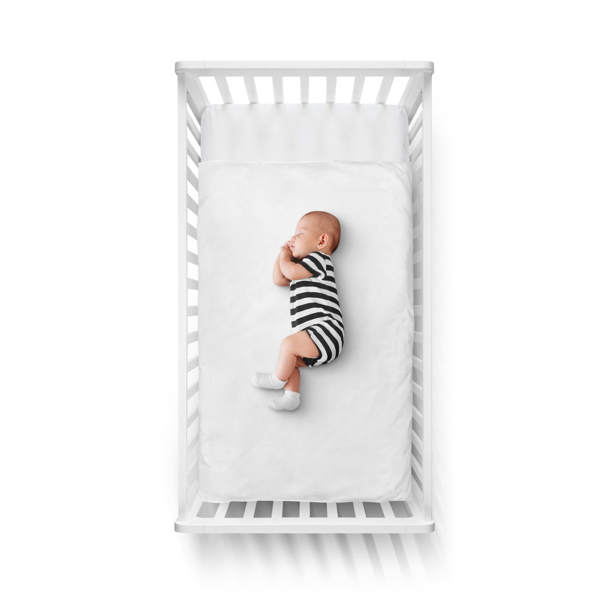baby sleeping in a crib | Batelle